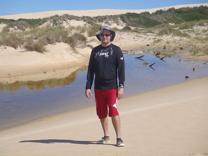 P4060076-F1000x1000.jpg - so we took a few photos.  Here I am at a soak in the sand dunes.  Who knew the sand held water?